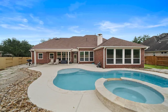 a view of a house with a swimming pool