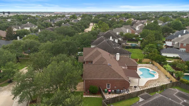 an aerial view of a house with a garden