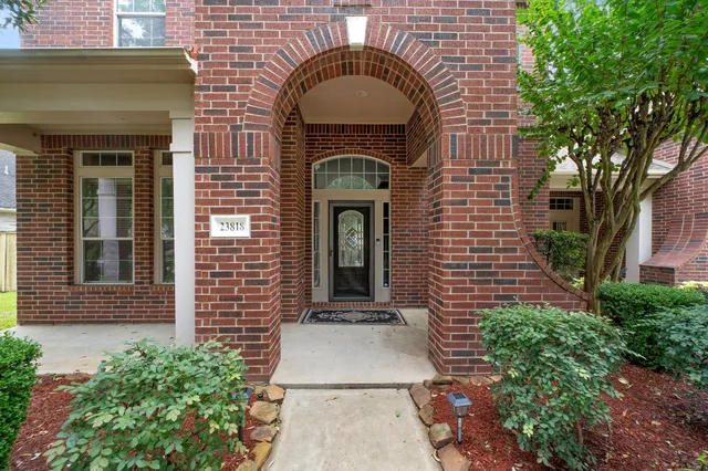 a front view of a house with large windows