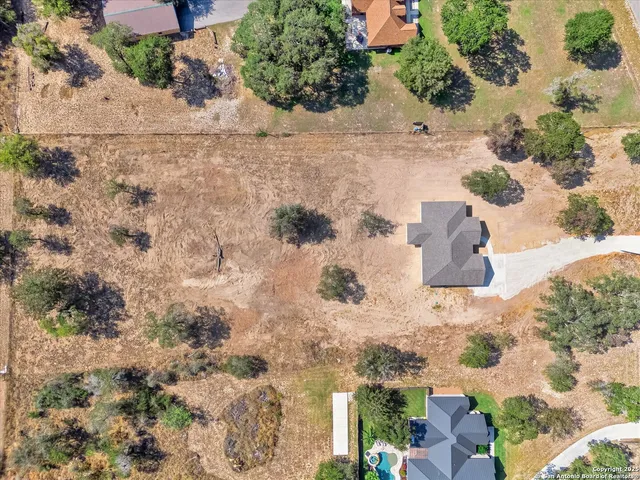 an aerial view of beach houses with outdoor space