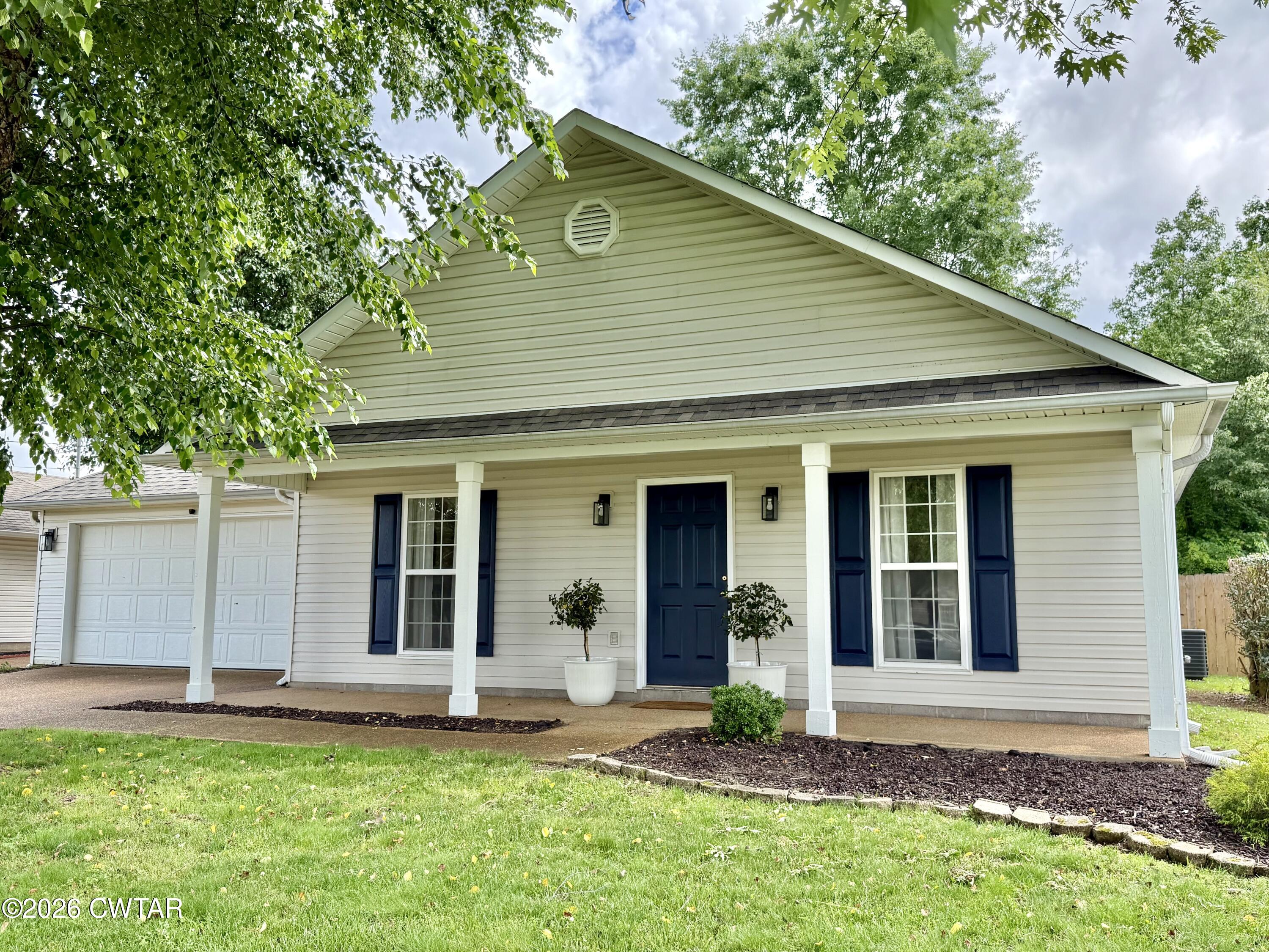 80 Rooker Drive Jackson, TN 38305 - Photo 30 of 30 a view of a house with a yard and plants