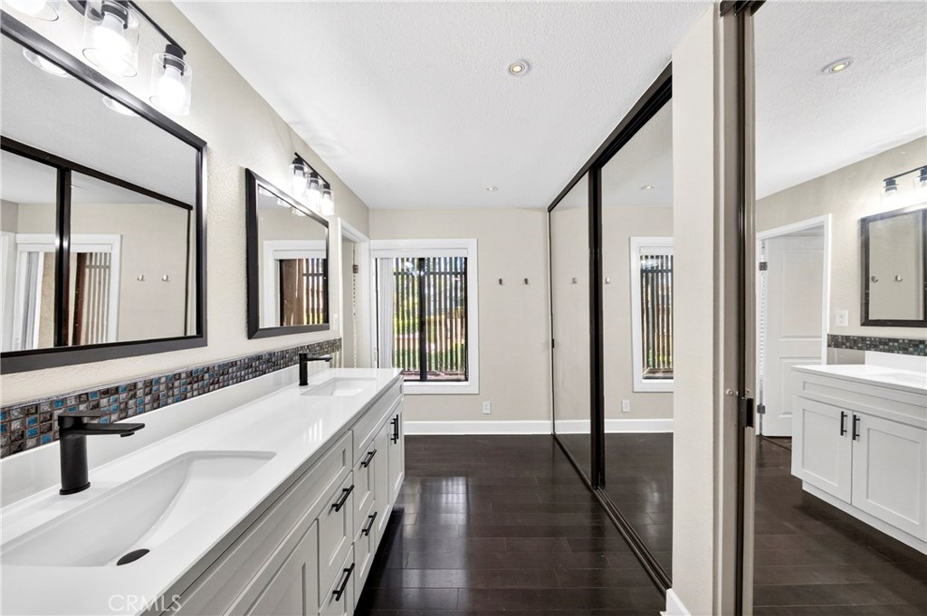 9 Madrona Irvine, CA 92612 - Photo 4 of 38 a spacious bathroom with a double vanity sink a mirror and a shower
