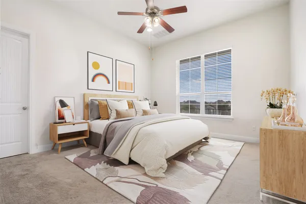a bedroom with a bed and a window