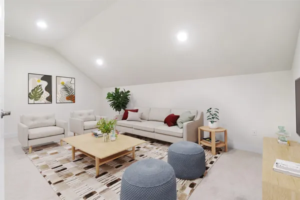 a living room with furniture and a table