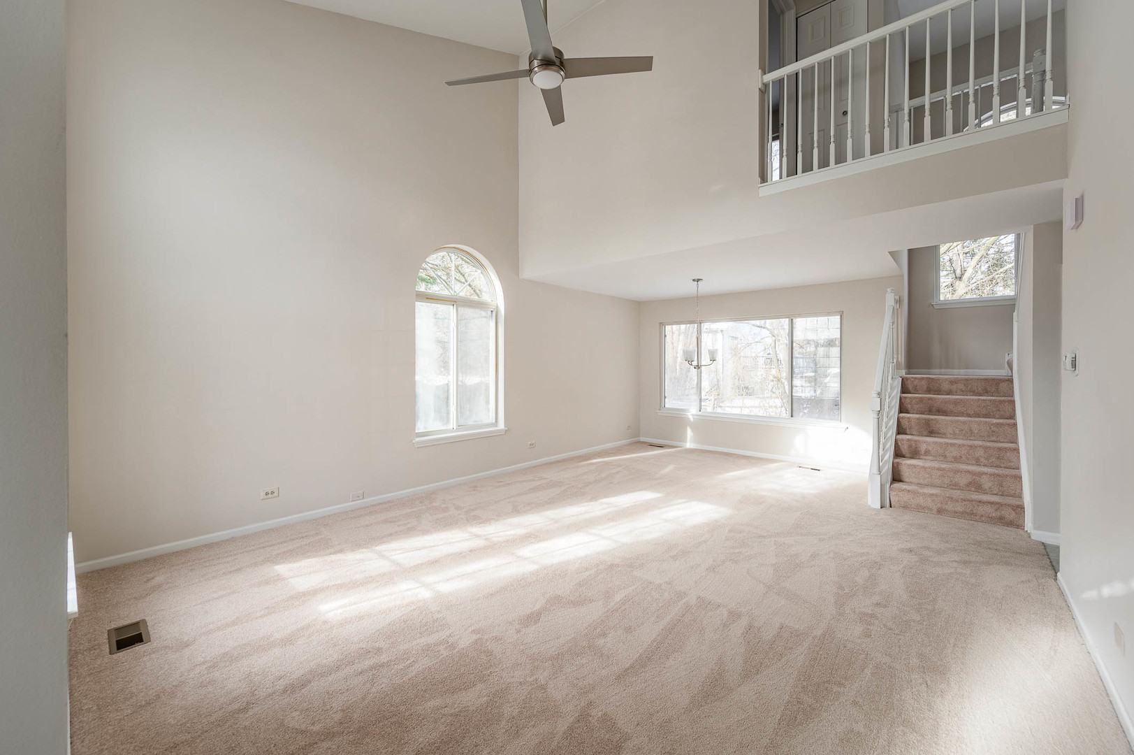 2284 North Pheasant Ridge Court Round Lake Beach, IL 60073 - Photo 2 of 11 an empty room with windows