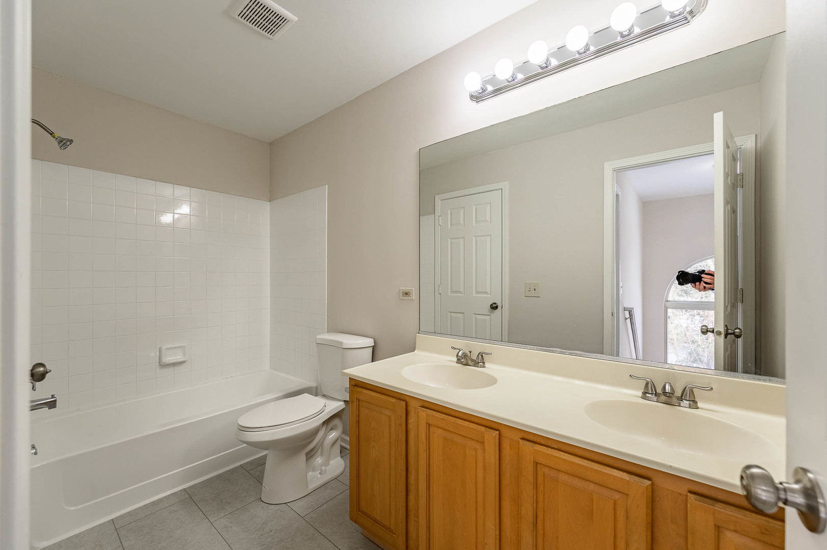 2284 North Pheasant Ridge Court Round Lake Beach, IL 60073 - Photo 6 of 11 a bathroom with a granite countertop sink a toilet and shower
