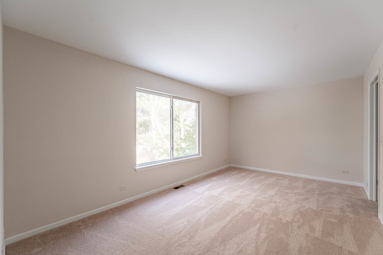 2284 North Pheasant Ridge Court Round Lake Beach, IL 60073 - Photo 7 of 11 an empty room with a window