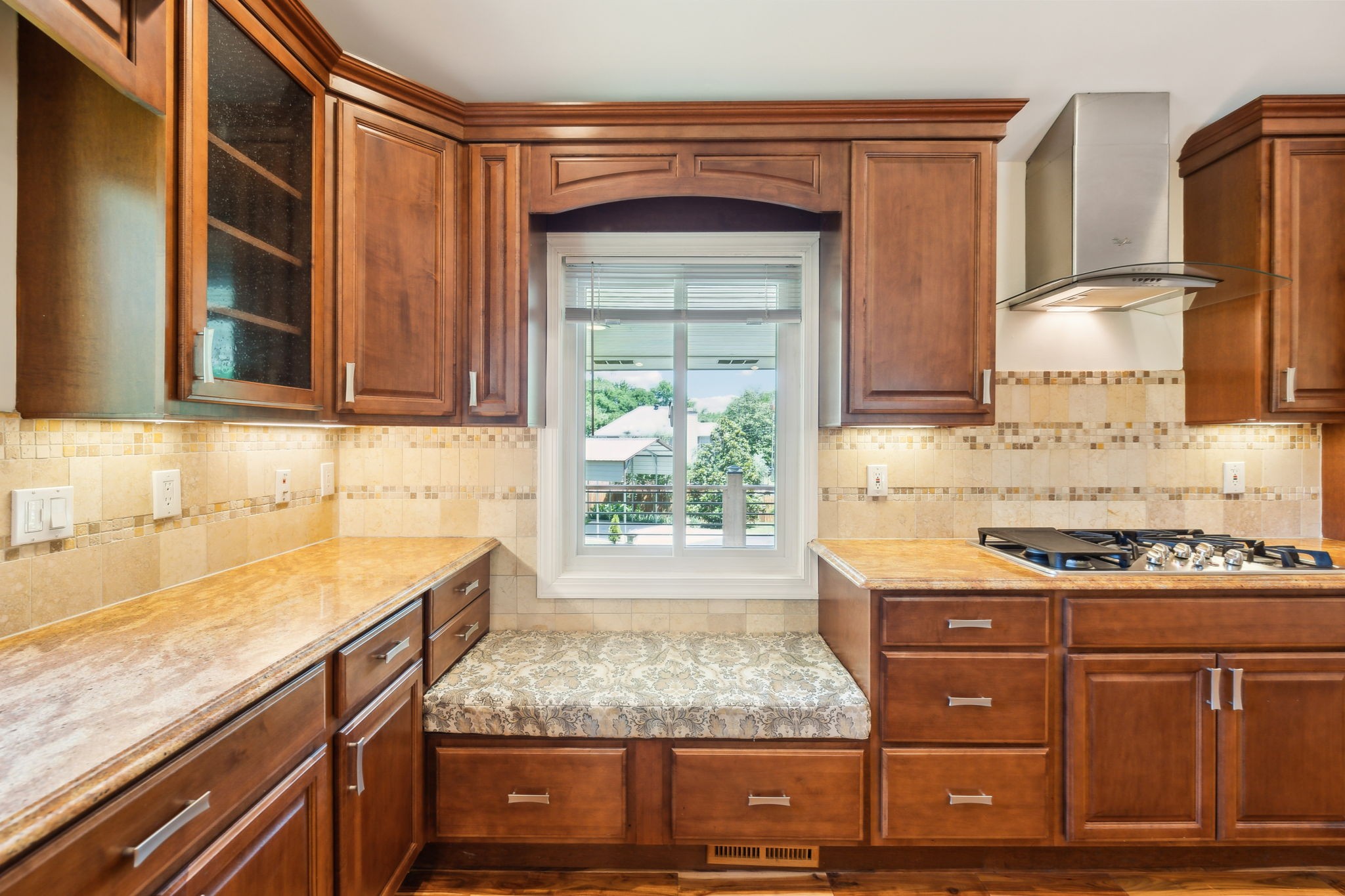 8166 Poplar Creek Road Nashville, TN 37221 - Photo 16 of 63 a kitchen with granite countertop a sink a stove and cabinets