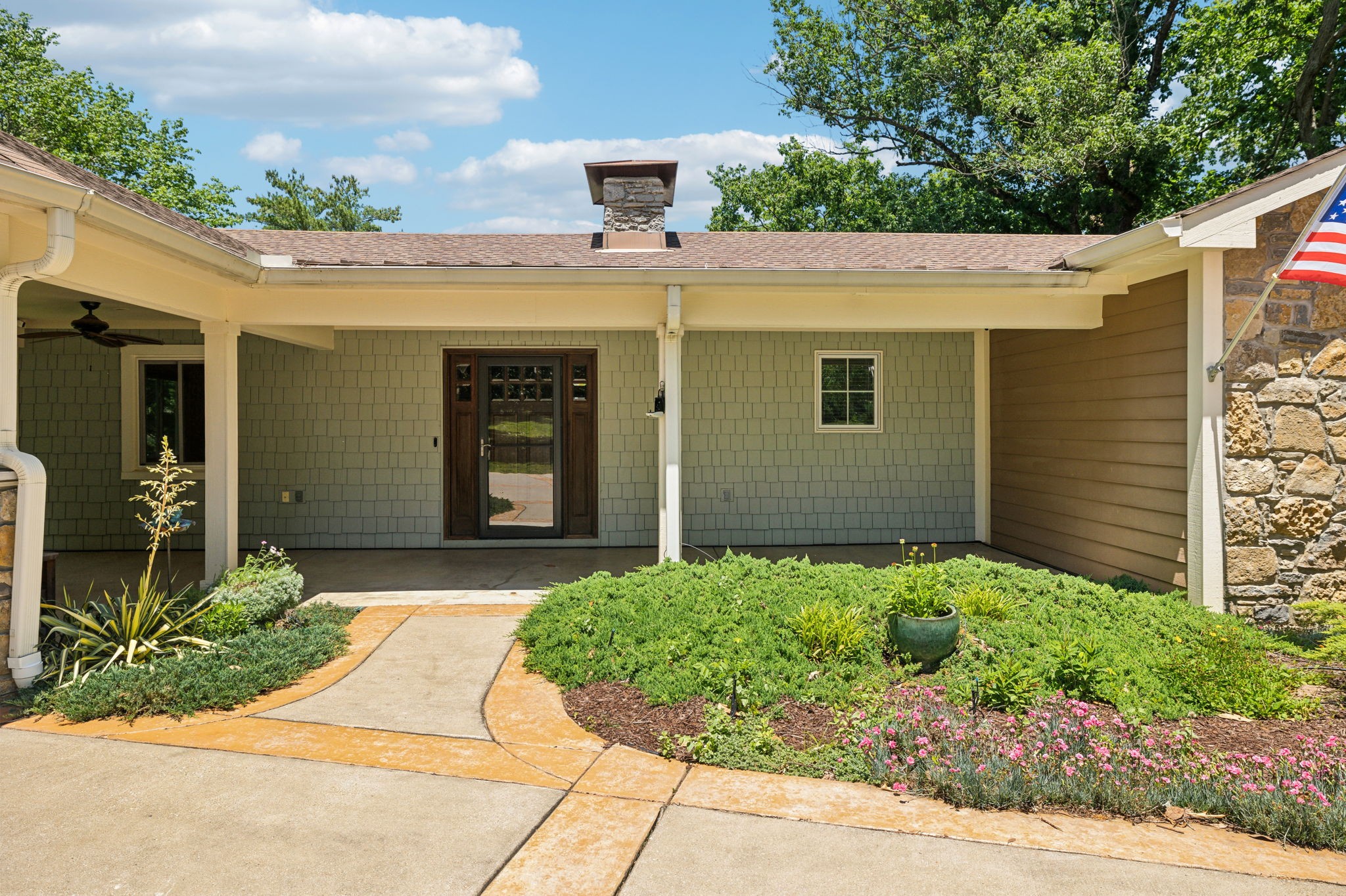 8166 Poplar Creek Road Nashville, TN 37221 - Photo 3 of 63 a view of a house with potted plants