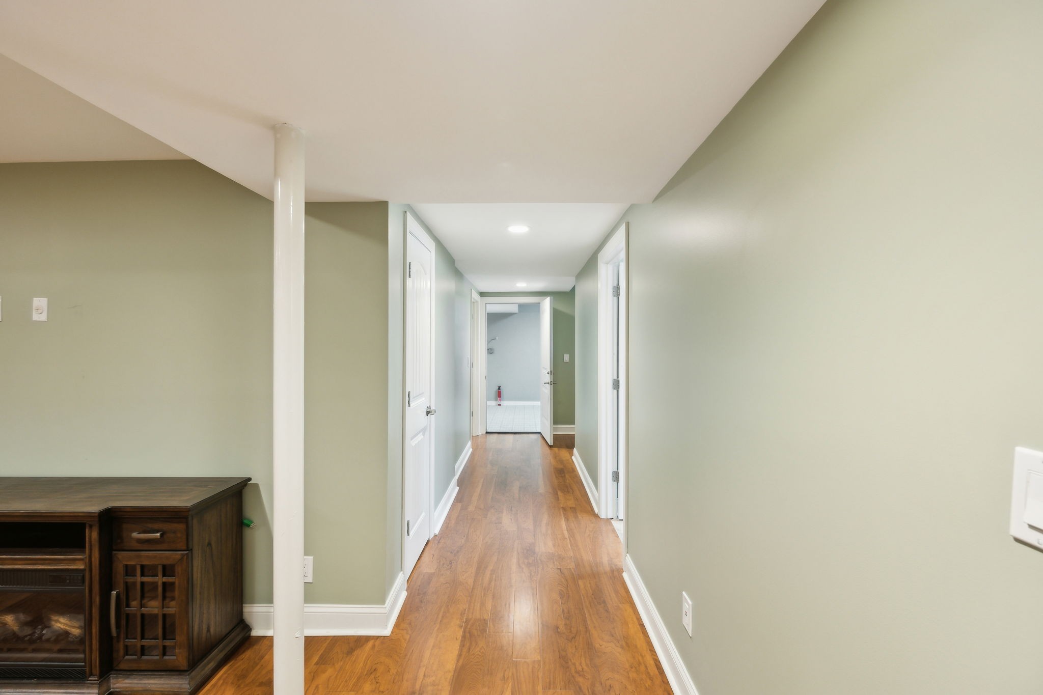 8166 Poplar Creek Road Nashville, TN 37221 - Photo 38 of 63 a view of a hallway with wooden floor and staircase