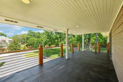 a view of a park with large trees