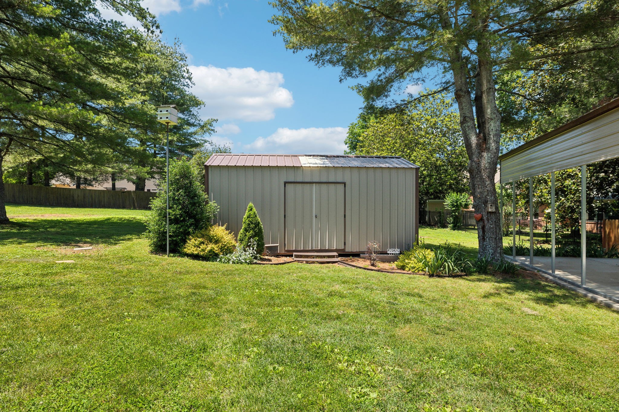 8166 Poplar Creek Road Nashville, TN 37221 - Photo 47 of 63 a view of a house with backyard and garden