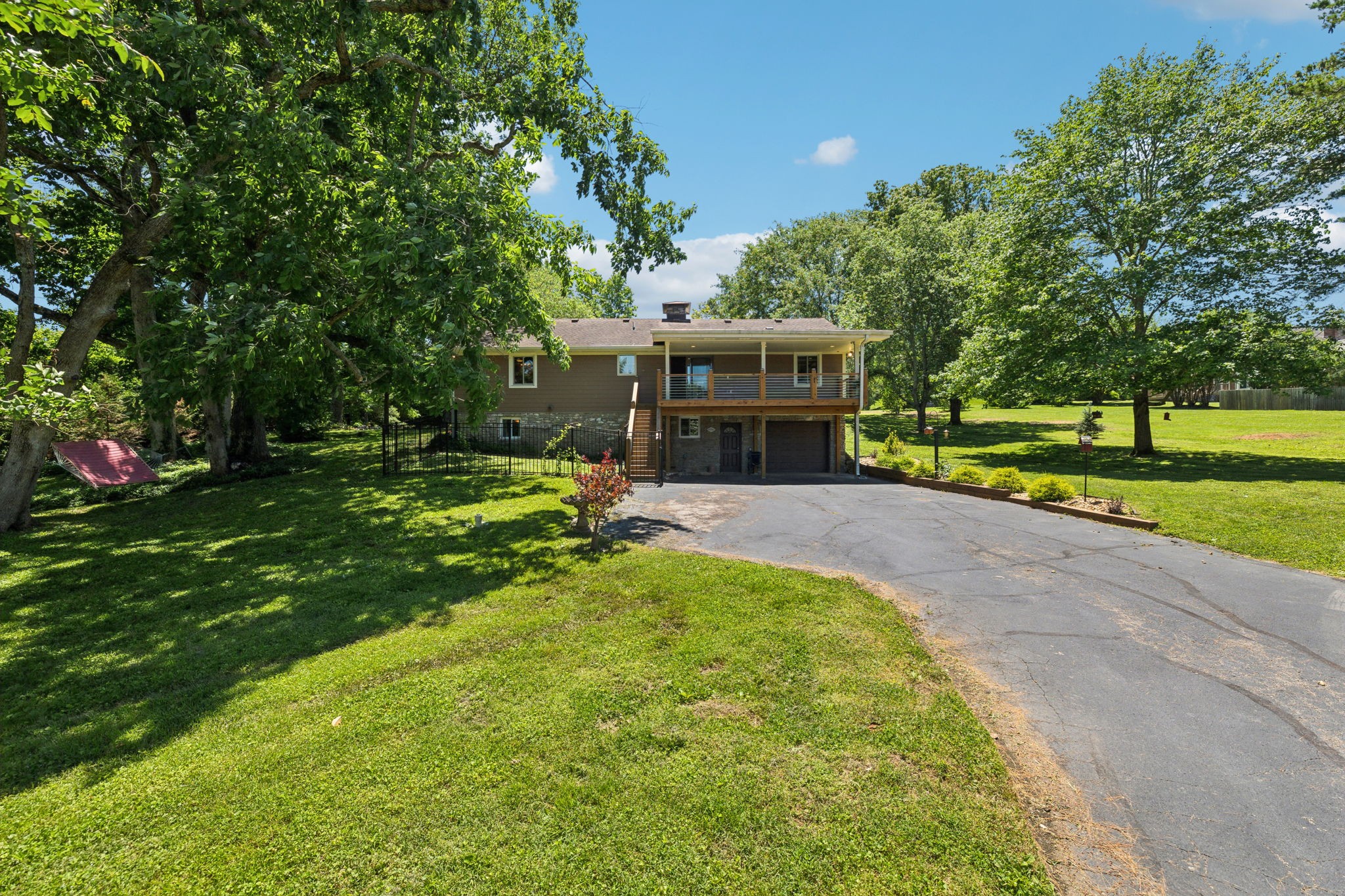 8166 Poplar Creek Road Nashville, TN 37221 - Photo 50 of 63 a view of a backyard with a garden and entertaining space