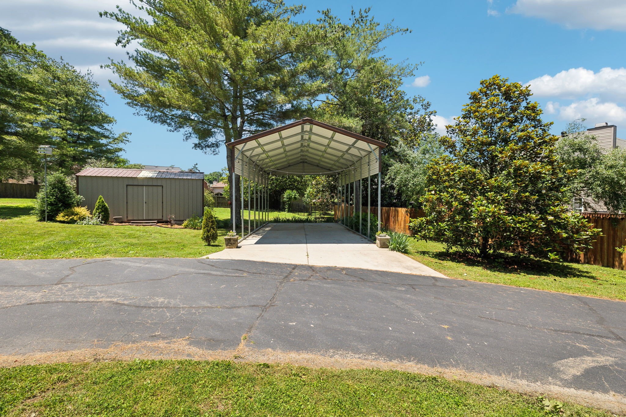 8166 Poplar Creek Road Nashville, TN 37221 - Photo 53 of 63 a view of a house with a yard and large tree