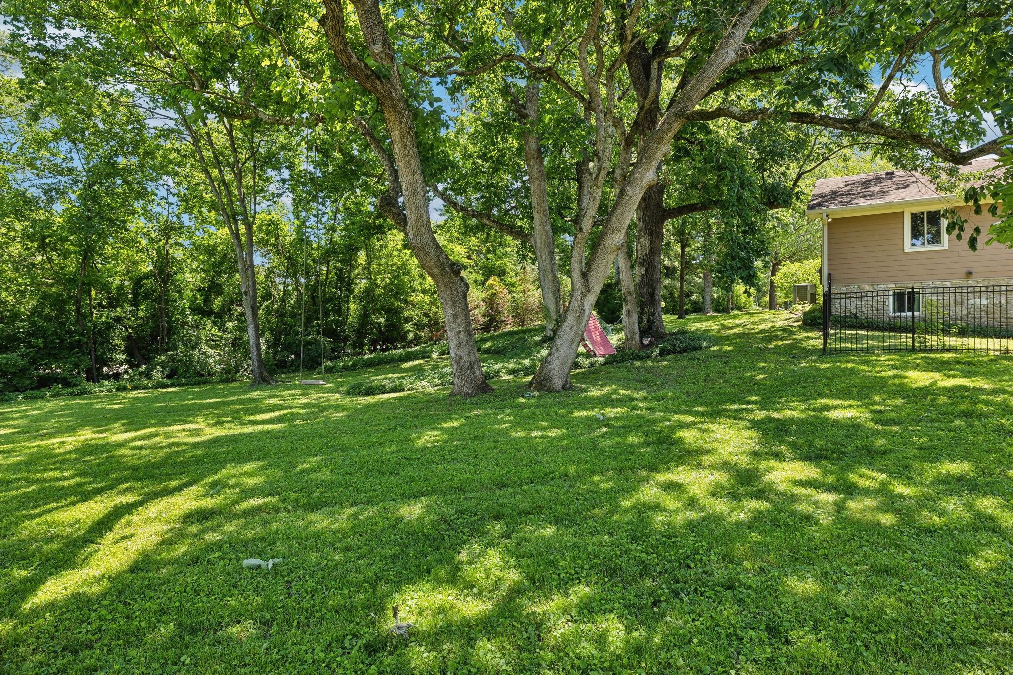 8166 Poplar Creek Road Nashville, TN 37221 - Photo 54 of 63 a view of a backyard with a large tree