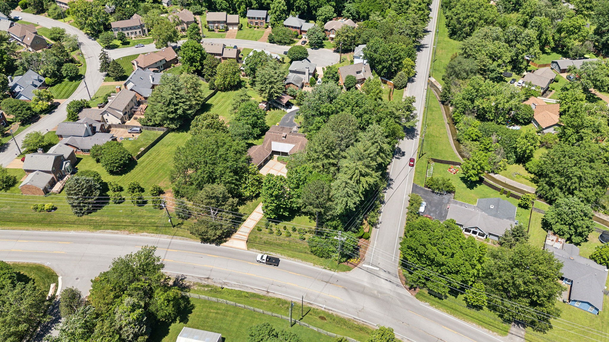 8166 Poplar Creek Road Nashville, TN 37221 - Photo 56 of 63 an aerial view of a house with a yard and garden