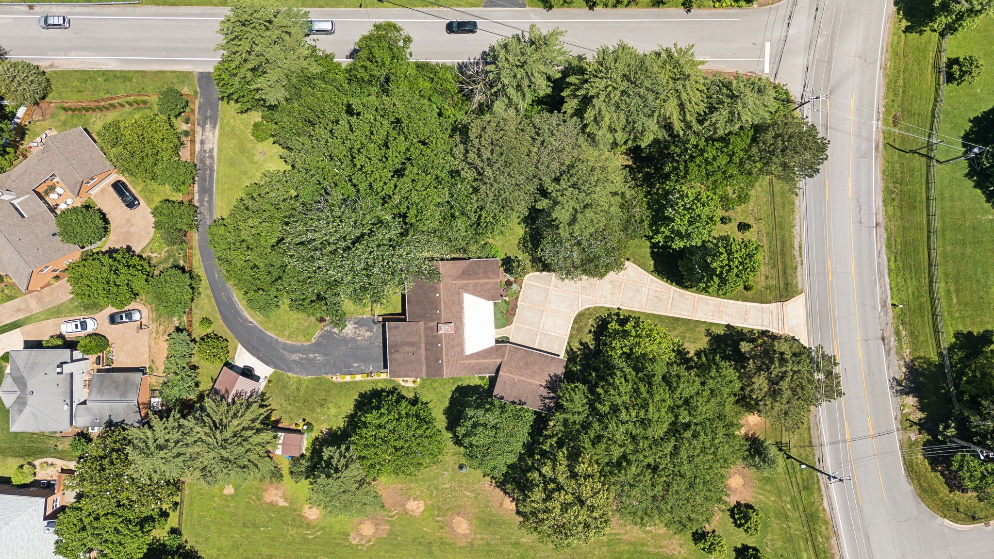 8166 Poplar Creek Road Nashville, TN 37221 - Photo 60 of 63 an aerial view of a house with swimming pool and garden