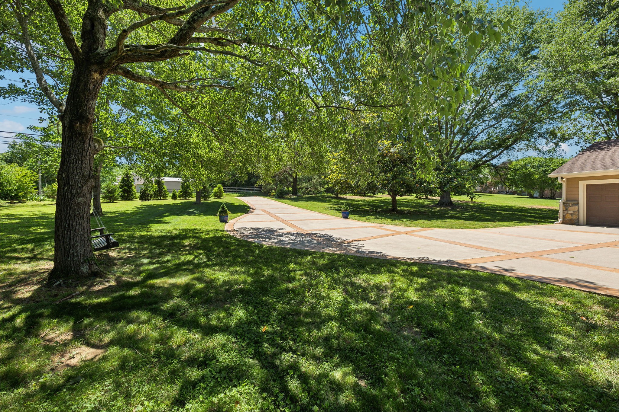 8166 Poplar Creek Road Nashville, TN 37221 - Photo 6 of 63 a big yard with lots of green space and trees