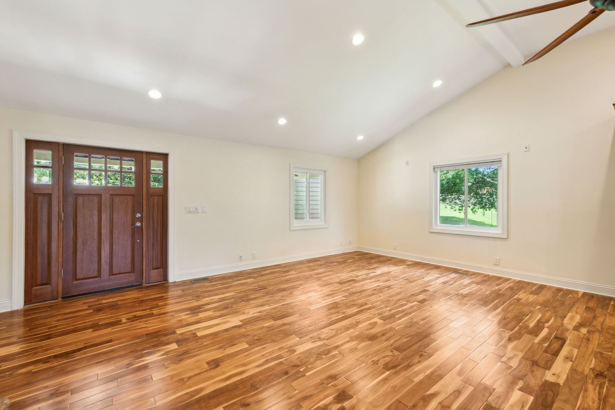 8166 Poplar Creek Road Nashville, TN 37221 - Photo 9 of 63 a view of an empty room with wooden floor and a window