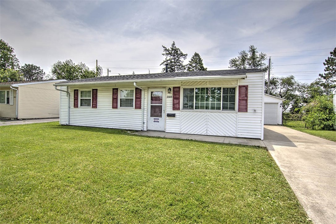 2809 East Cardinal Drive Decatur, IL 62526 - Photo 1 of 20 a view of a house with pool and garden