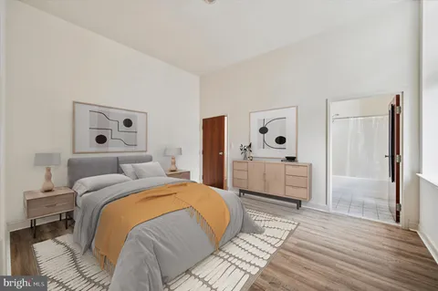 a bedroom with a bed and a dresser