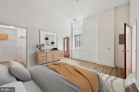 a bedroom with a bed and a couch