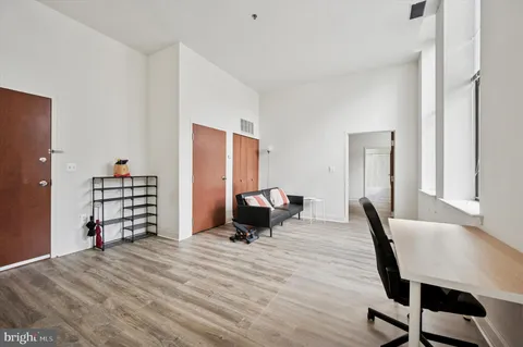 a room with a bed and furniture