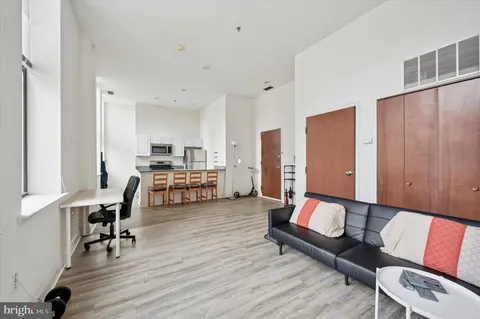 a living room with furniture and a table