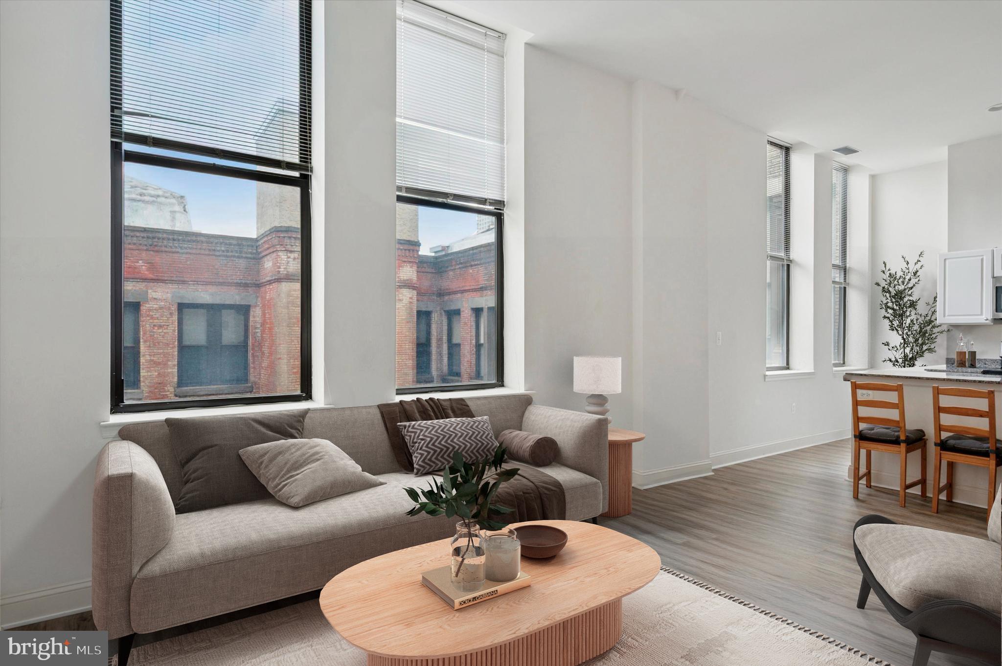 1001 Chestnut Street, Unit 904W Philadelphia, PA 19103 - Photo 6 of 25 a living room with furniture and a large window