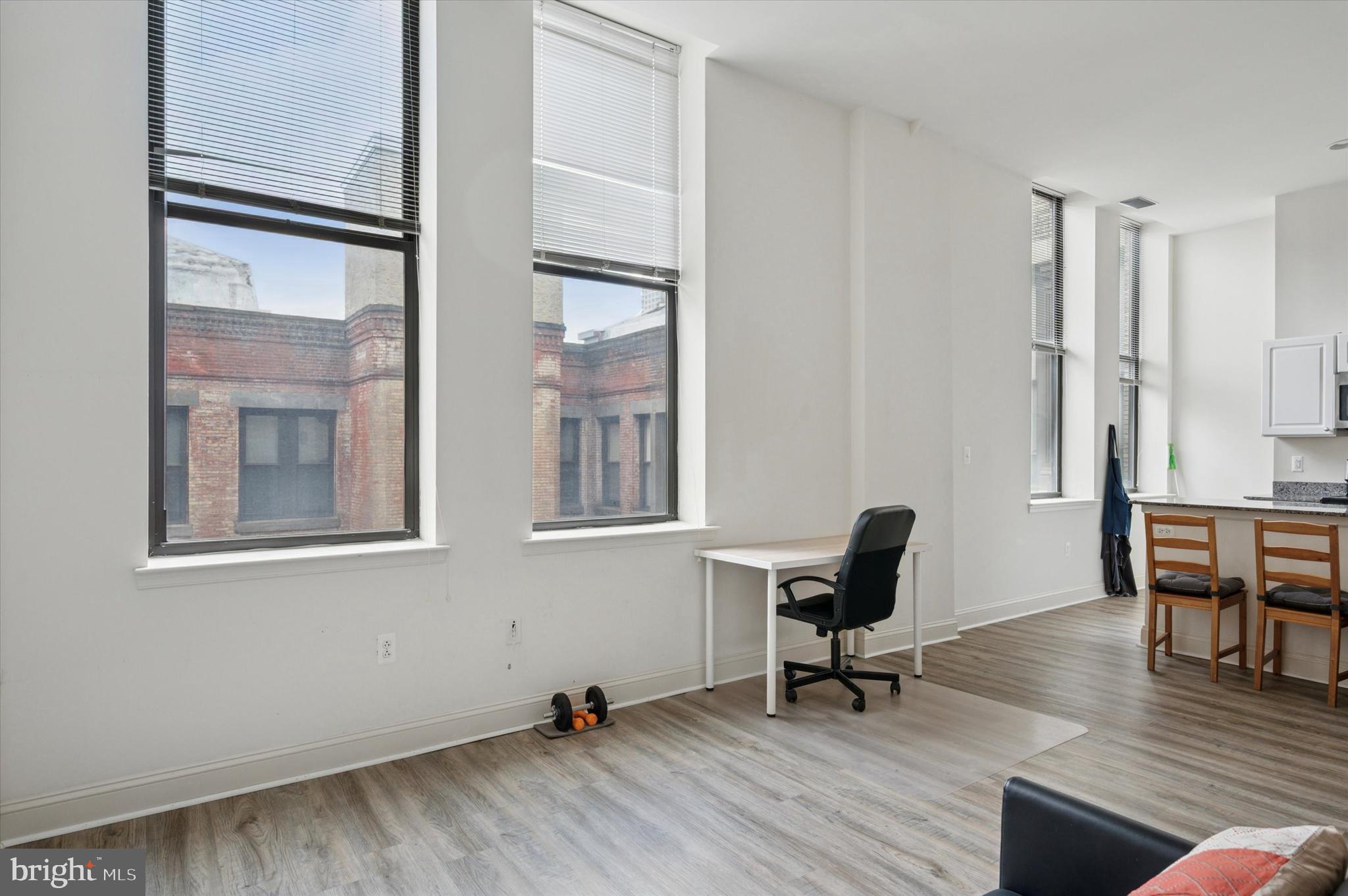 1001 Chestnut Street, Unit 904W Philadelphia, PA 19103 - Photo 7 of 25 a view of a workspace with furniture and a window