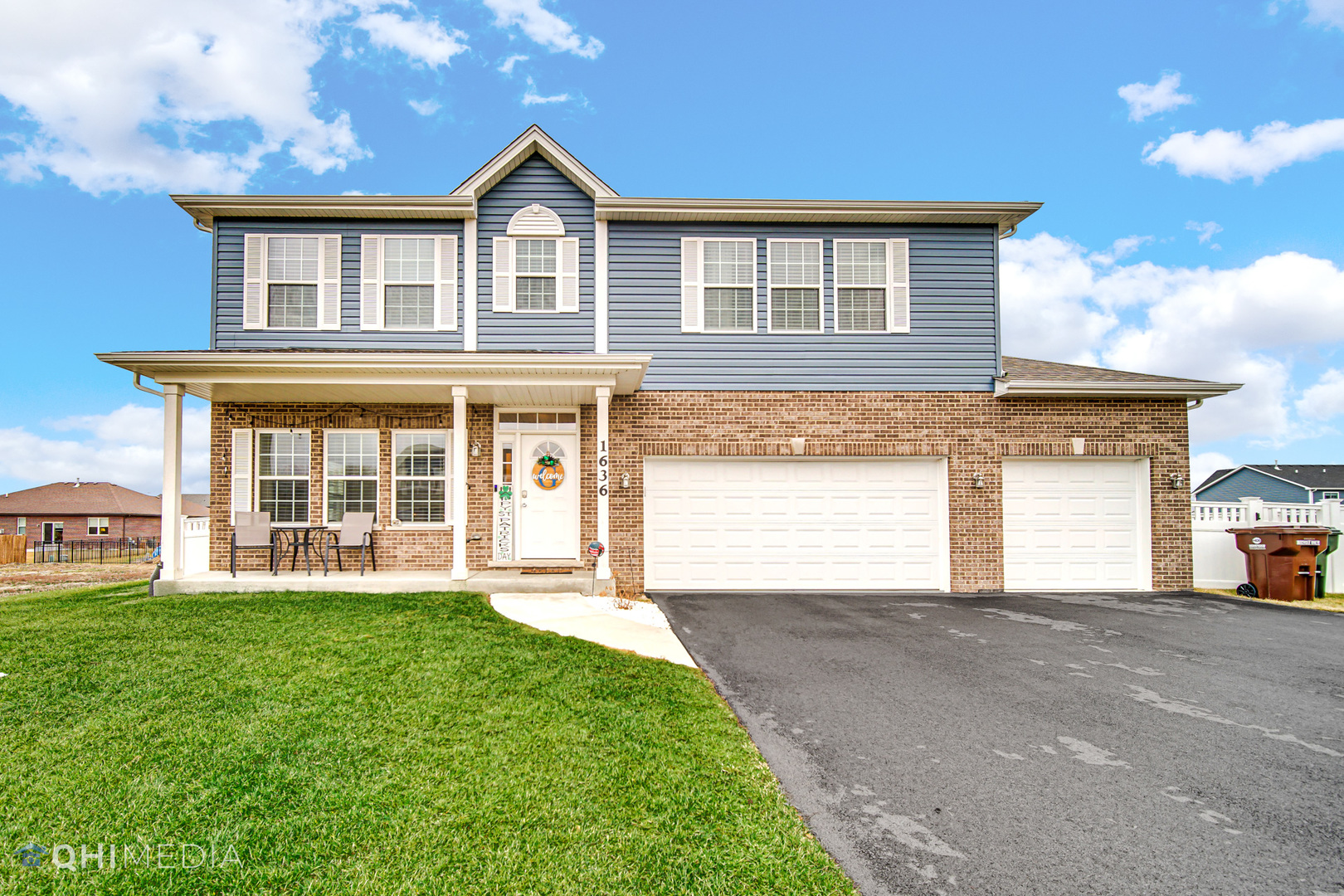 1636 Edentenny Road New Lenox, IL 60451 - Photo 1 of 19 a front view of a house with a yard and garage
