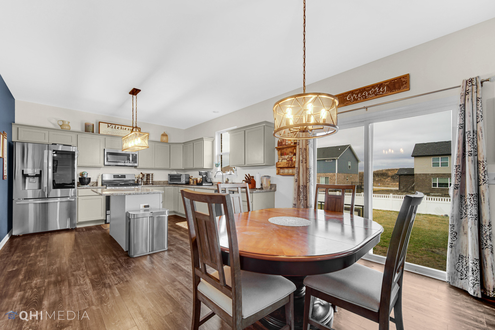 1636 Edentenny Road New Lenox, IL 60451 - Photo 5 of 19 a kitchen with stainless steel appliances granite countertop a dining table chairs and white cabinets
