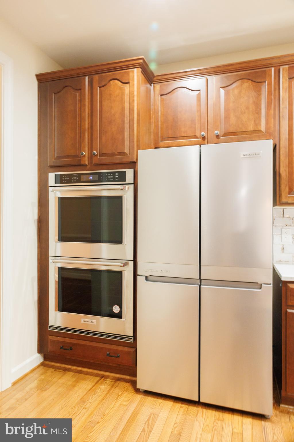 8623 James Creek Drive Springfield, VA 22152 - Photo 17 of 69 a kitchen with a refrigerator and a window