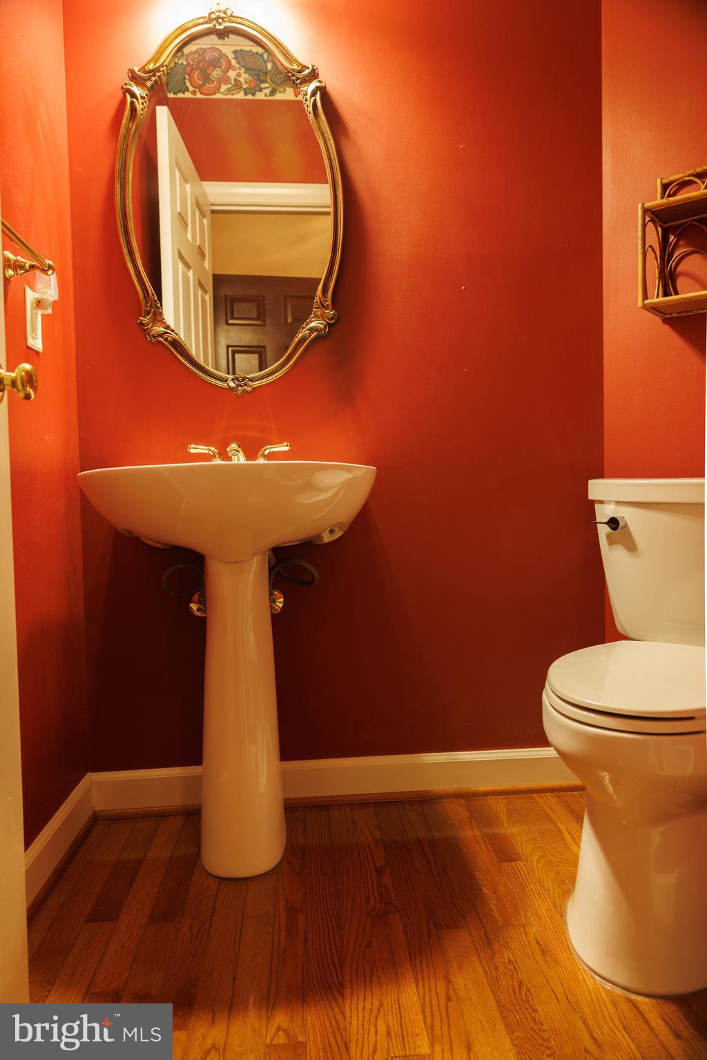 8623 James Creek Drive Springfield, VA 22152 - Photo 31 of 69 a bathroom with a toilet and a mirror