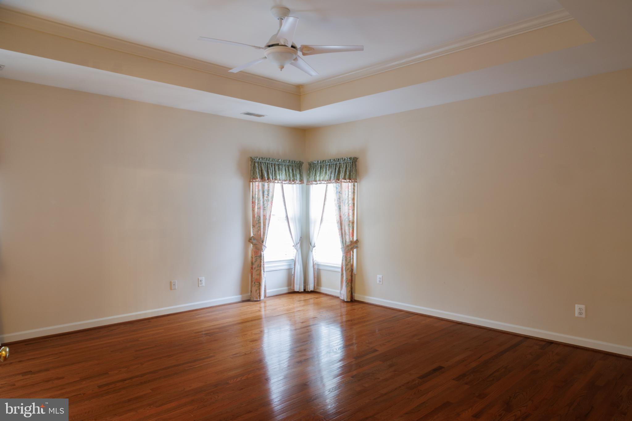 8623 James Creek Drive Springfield, VA 22152 - Photo 33 of 69 a view of an empty room with wooden floor and a window