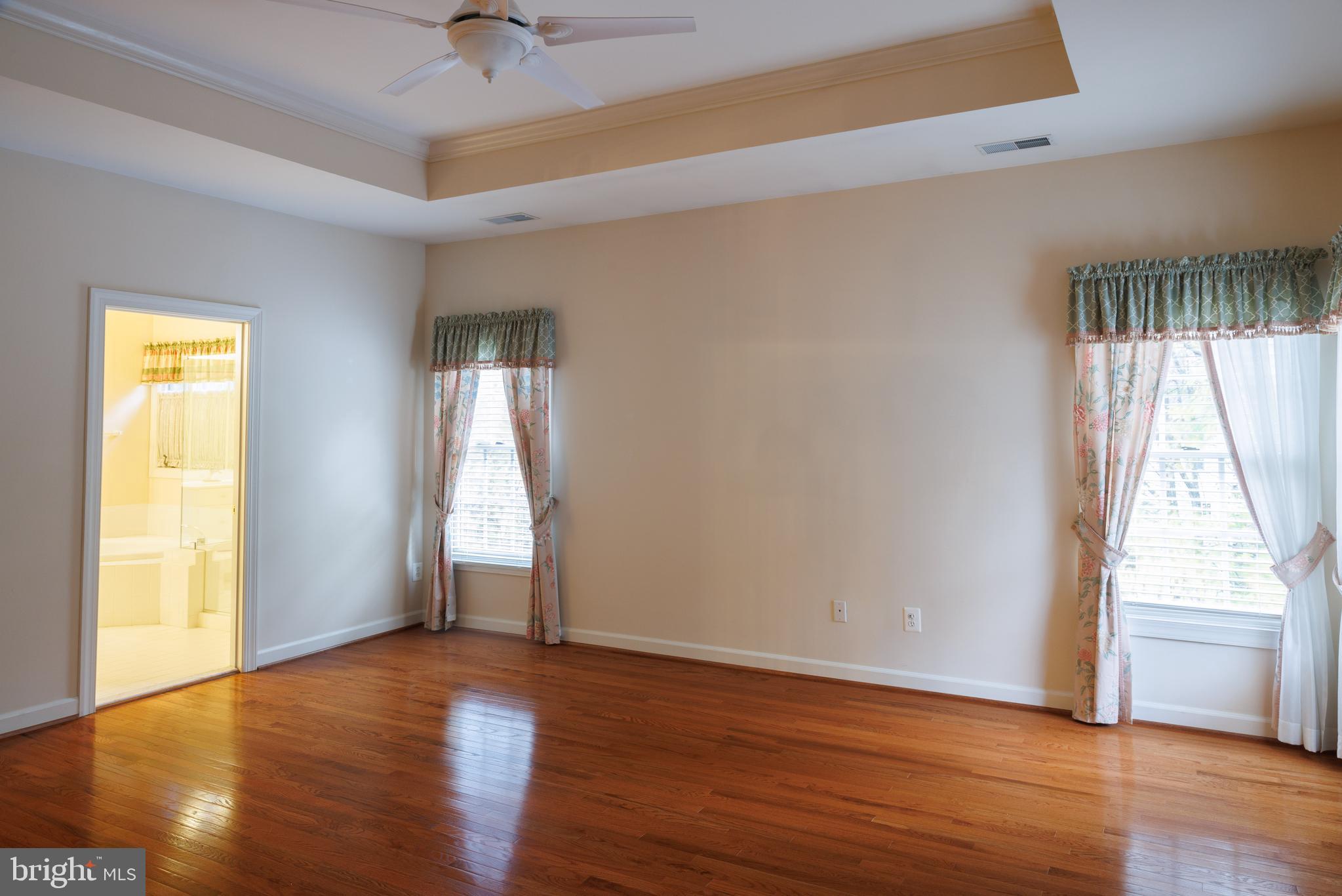 8623 James Creek Drive Springfield, VA 22152 - Photo 34 of 69 a view of an empty room with wooden floor and a window