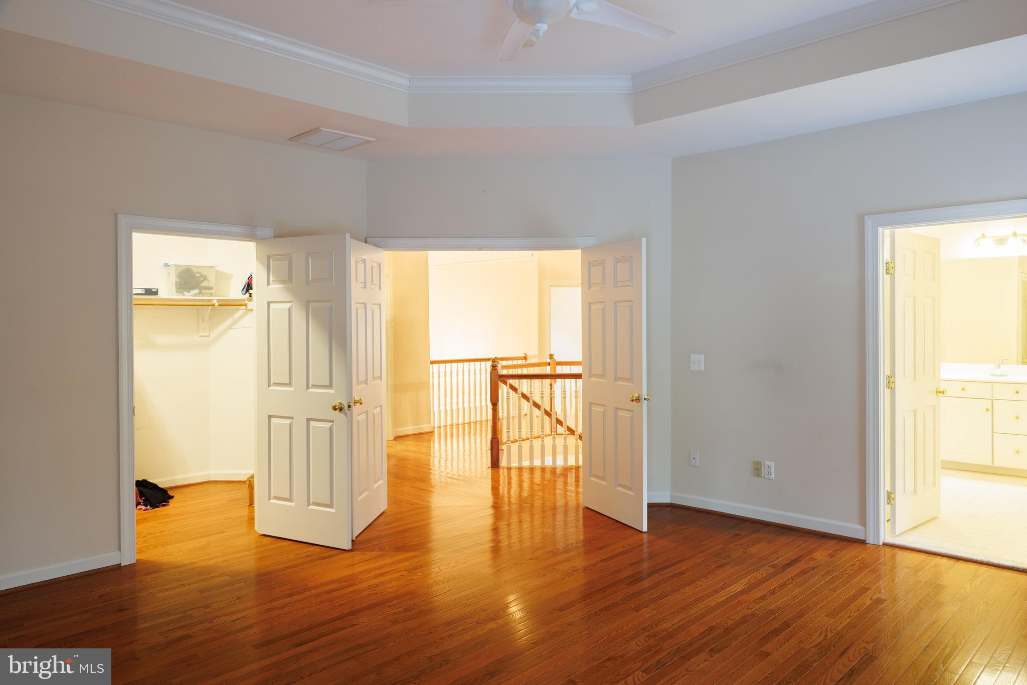 8623 James Creek Drive Springfield, VA 22152 - Photo 35 of 69 a view of empty room with wooden floor and fireplace