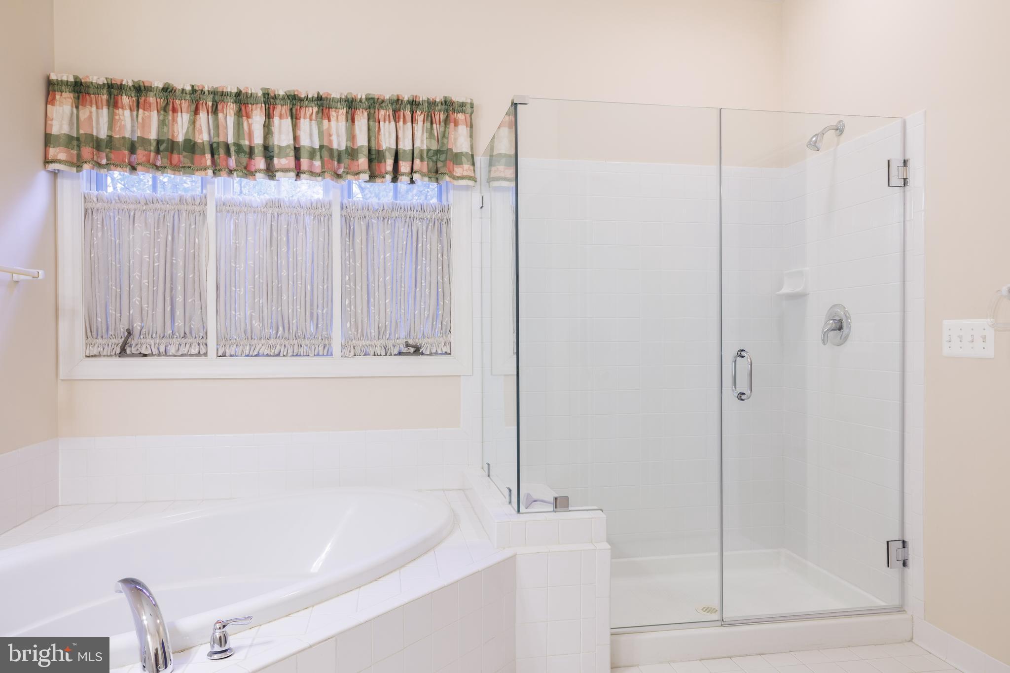 8623 James Creek Drive Springfield, VA 22152 - Photo 36 of 69 a bathroom with bathtub and shower