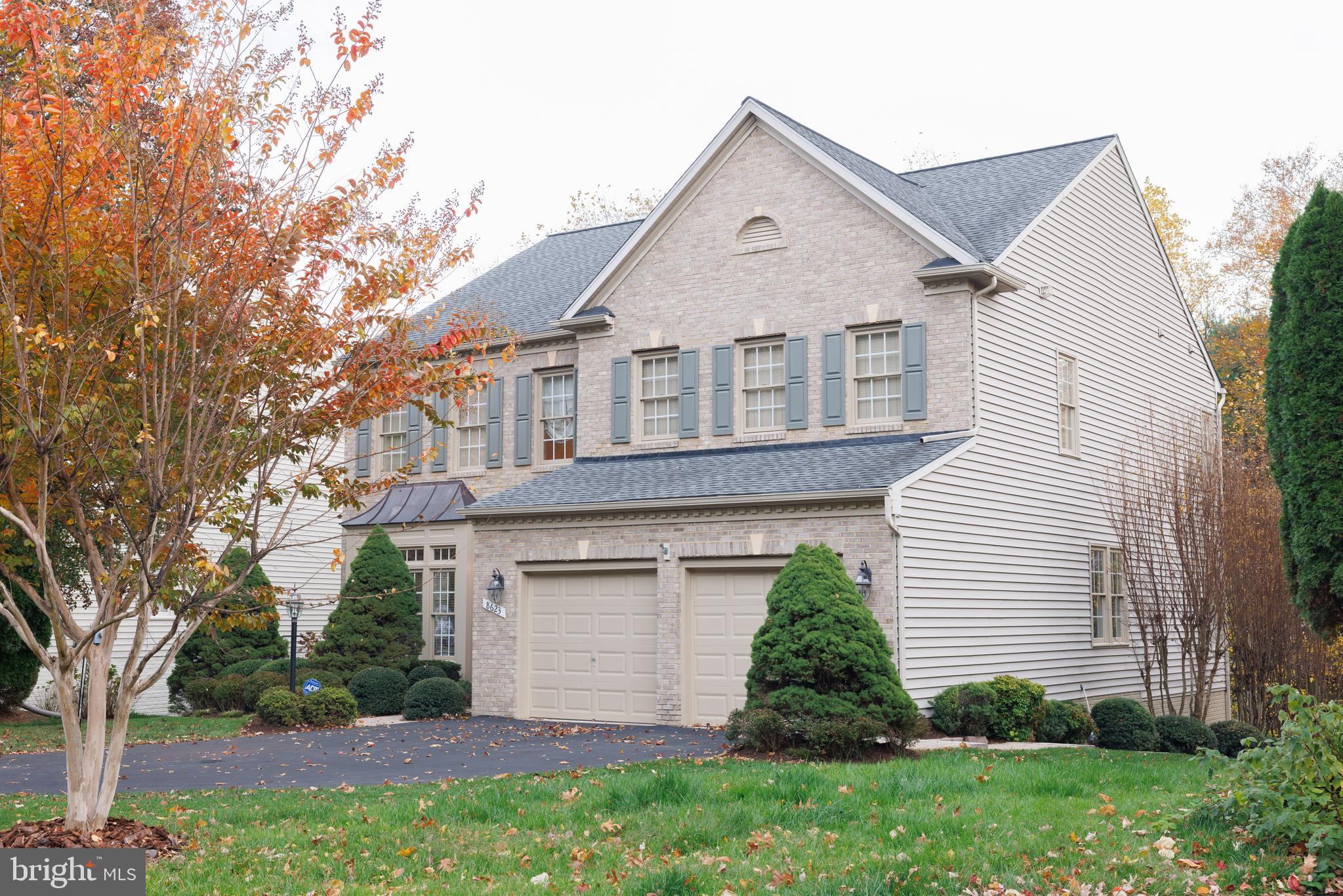 8623 James Creek Drive Springfield, VA 22152 - Photo 4 of 69 a front view of a house with a garden and plants