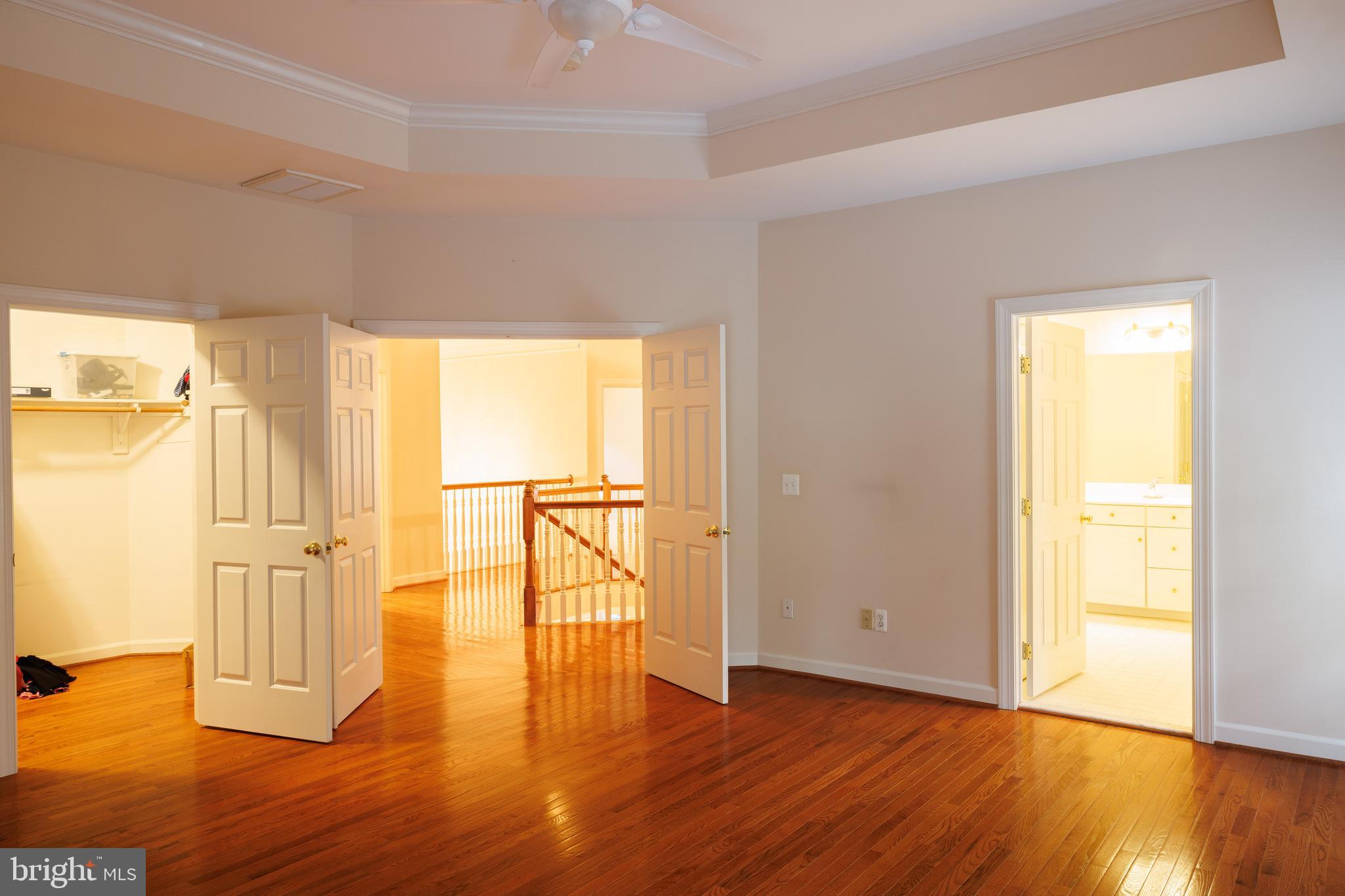 8623 James Creek Drive Springfield, VA 22152 - Photo 42 of 69 a view of empty room with wooden floor and fan