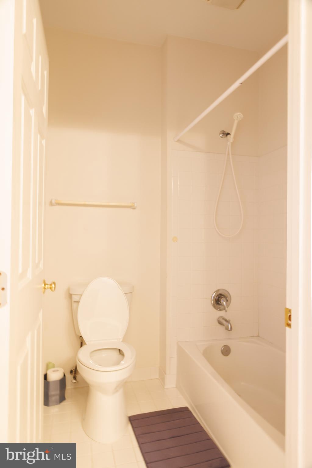 8623 James Creek Drive Springfield, VA 22152 - Photo 49 of 69 a bathroom with a toilet and a bathtub