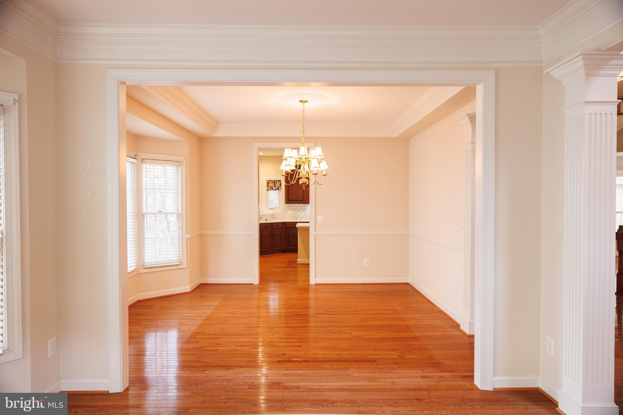 8623 James Creek Drive Springfield, VA 22152 - Photo 7 of 69 a view of a room with wooden floor and a window