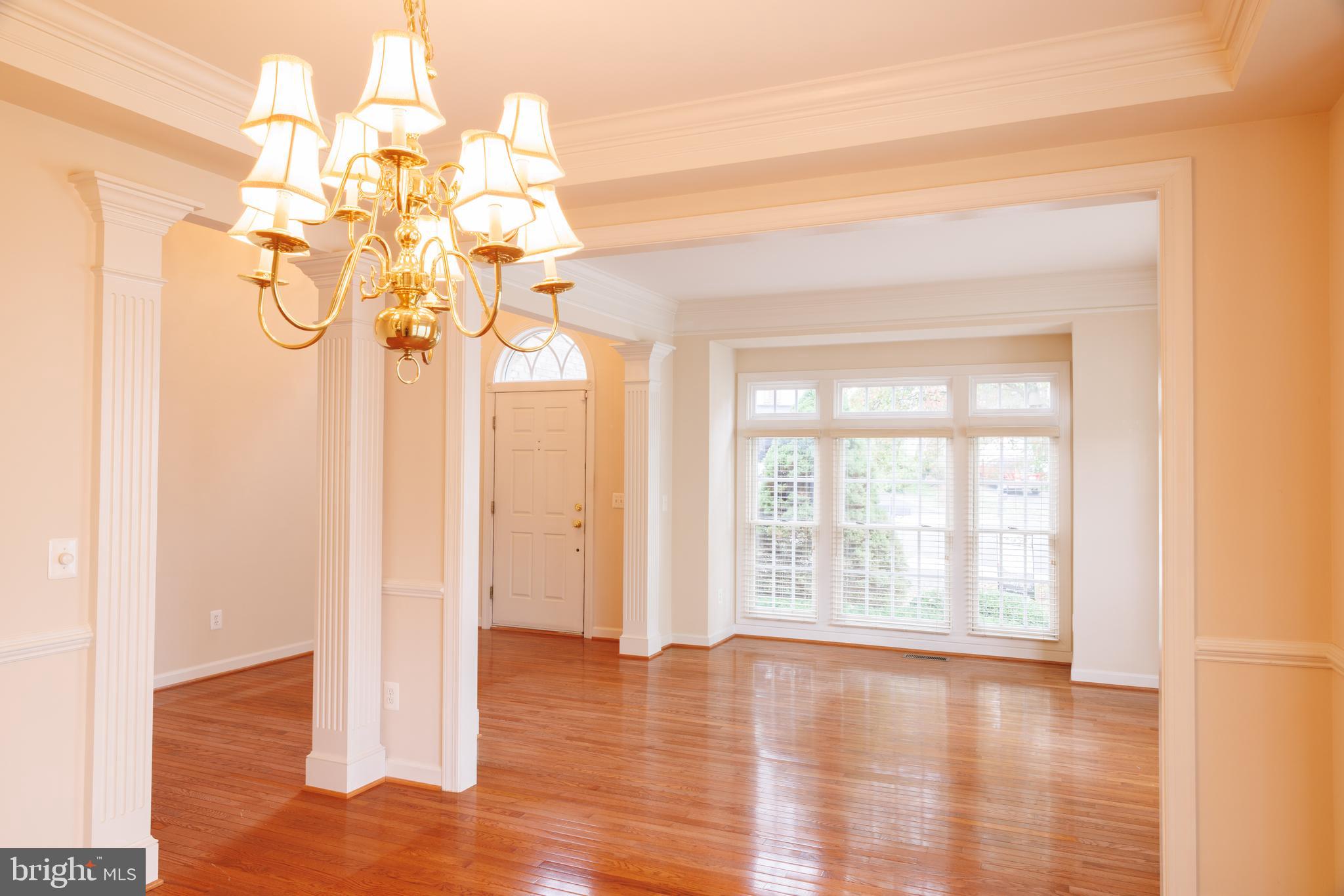 8623 James Creek Drive Springfield, VA 22152 - Photo 9 of 69 a view of a room with wooden floor and a window