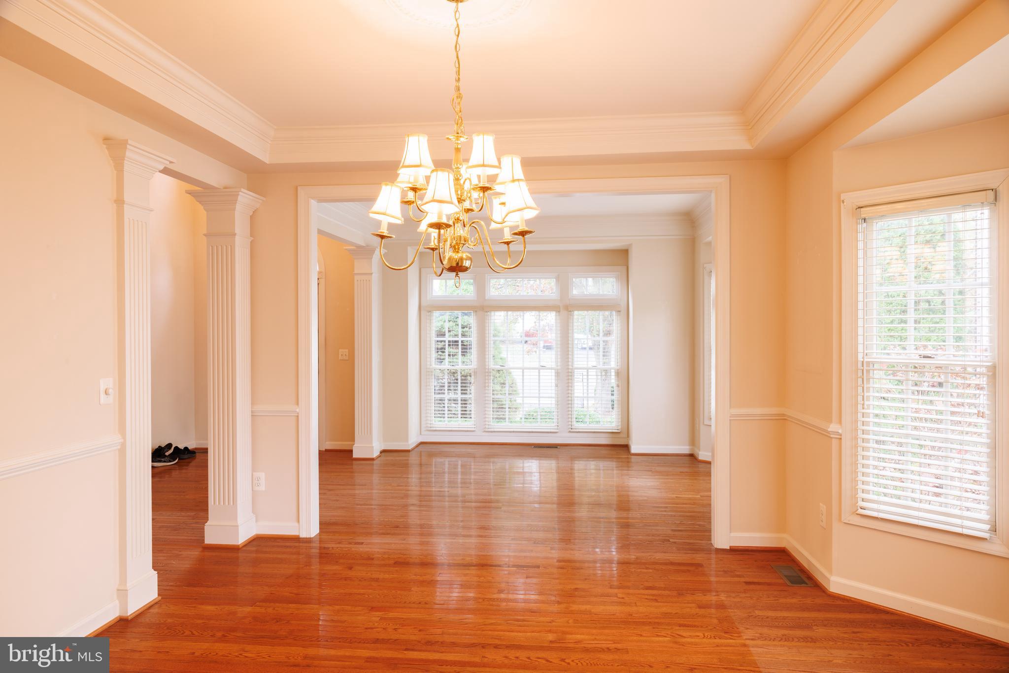 8623 James Creek Drive Springfield, VA 22152 - Photo 10 of 69 a view of an empty room with wooden floor and a window
