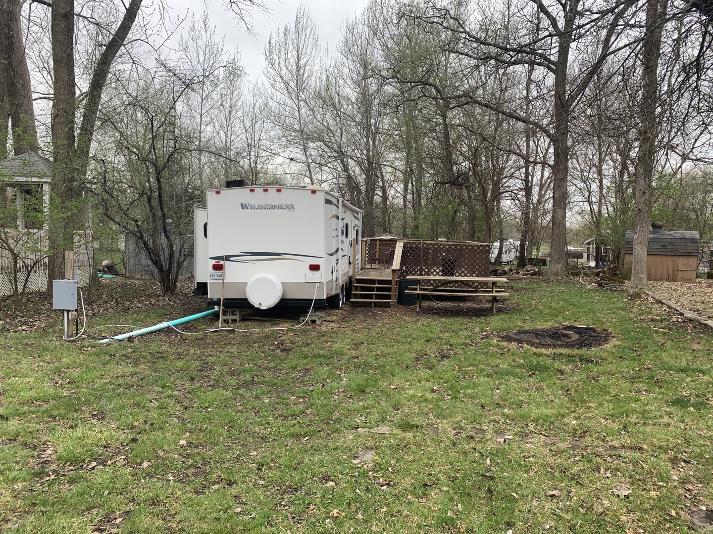 5-6 Woodhaven Sublette, IL 61367 - Photo 2 of 10 a view of a backyard with lawn chairs and a large tree