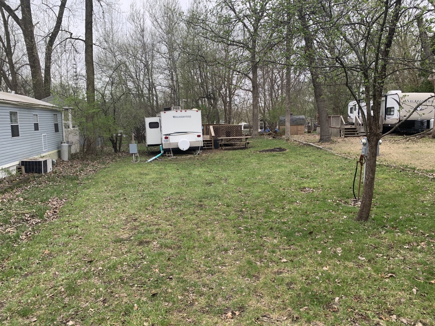 5-6 Woodhaven Sublette, IL 61367 - Photo 6 of 10 a white house covered with tall trees