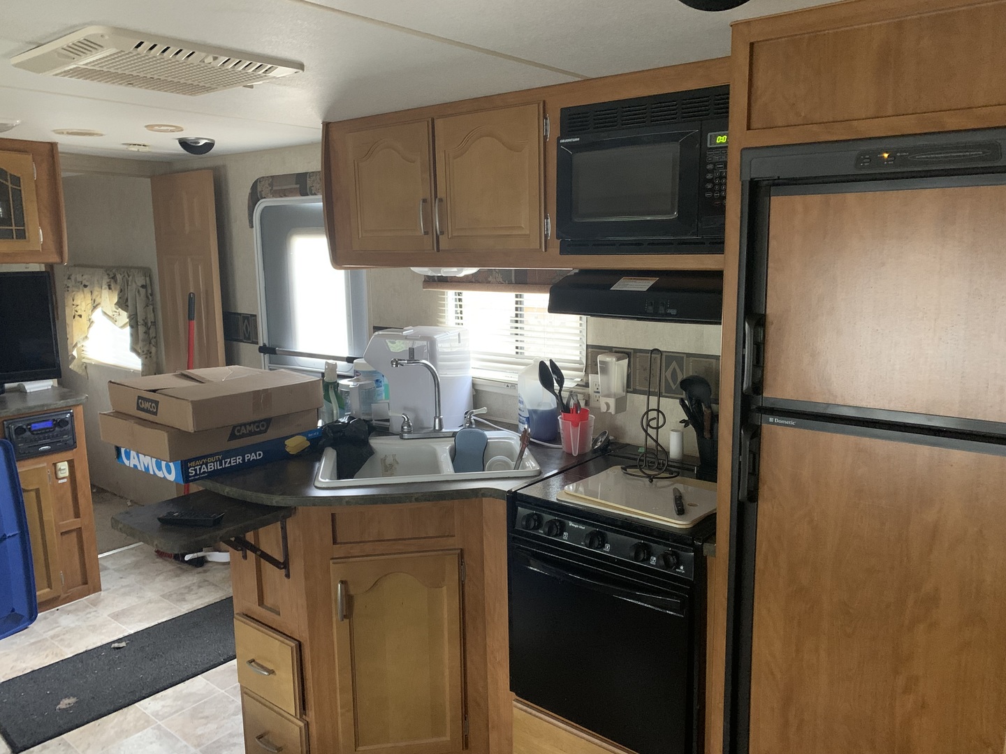5-6 Woodhaven Sublette, IL 61367 - Photo 7 of 10 a kitchen with stainless steel appliances granite countertop a refrigerator stove and sink