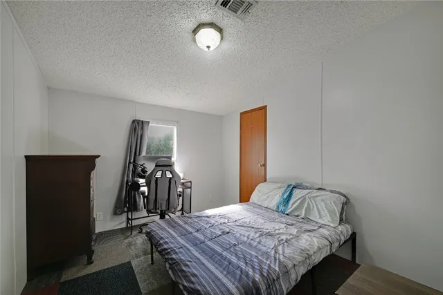 a bedroom with a bed and a walk in closet