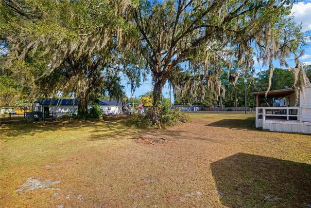 a view of yard with swimming pool