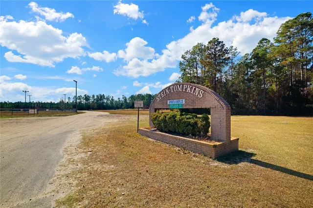 a view of a lake with a yard
